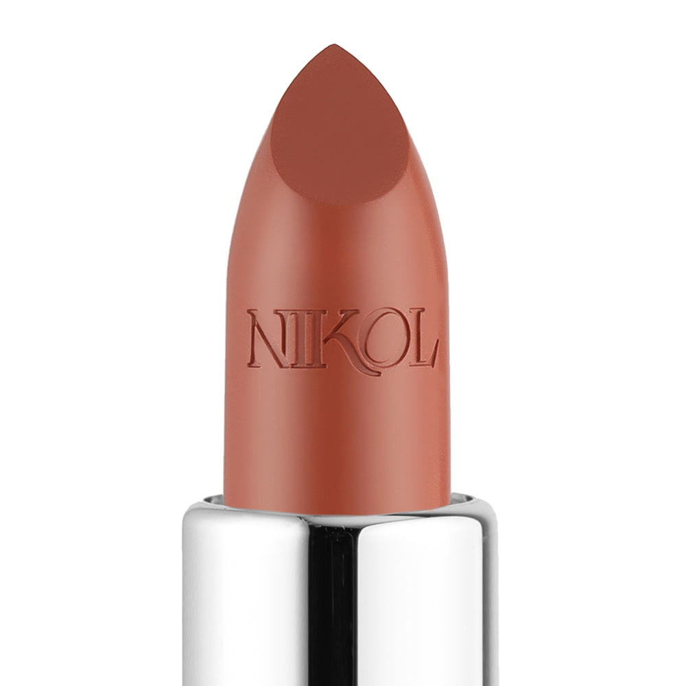 A close-up of the creamy 1975 Shiny Velvet Cream Lipstick #9 in a smooth brown-beige by Shopgalaxys, embossed with NIKOL. Its gleaming silver base and pointed tip ensure a perfect, cruelty-free pout.