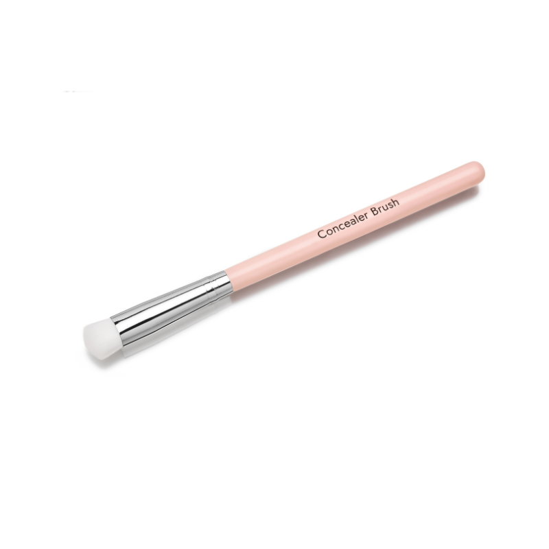 The Shopgalaxys Concealer Brush is cruelty-free with a light pink handle, silver ferrule, and white bristles. Diagonally placed on a white background, its labeled Concealer Brush and ideal for flawless coverage.