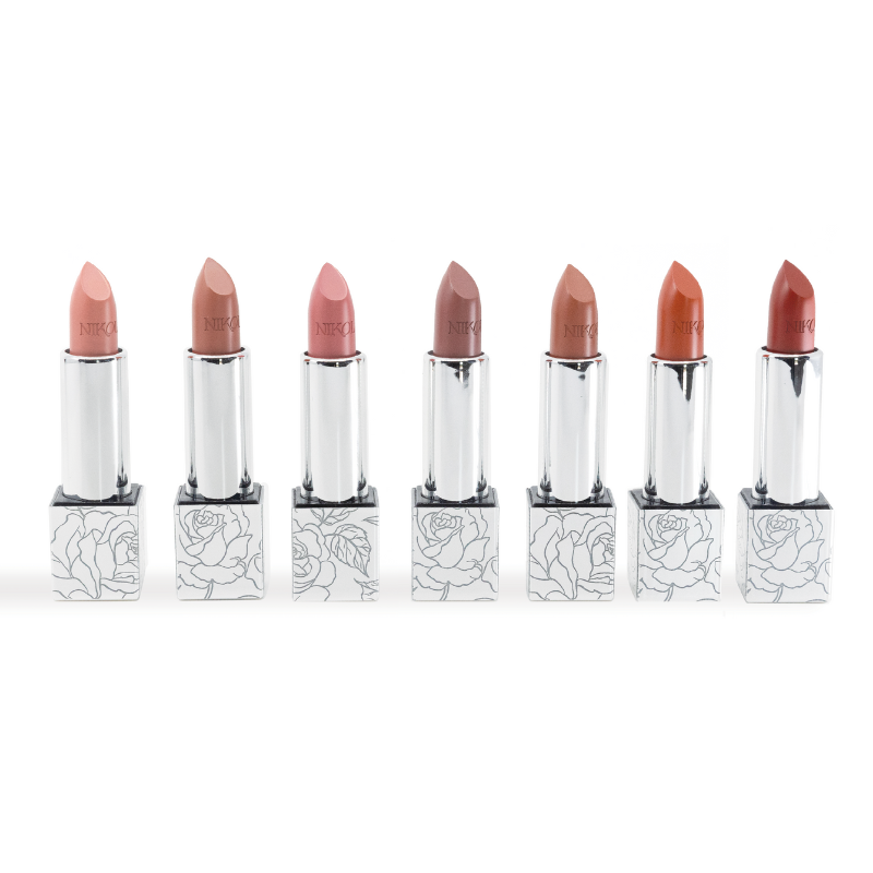 The Shopgalaxys Lipstick Collection showcases seven stunning nude shades, each in an elegantly upright silver tube with a delicate floral pattern at the base, ideal for displaying in a limited-edition gift box.