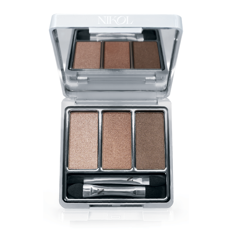 Nikol Beautys Le Bottled Blonde 3-Well Eyeshadow Palette features an open silver compact with three brown shades in a clean beauty design. This vegan product includes a small double-ended applicator brush beneath the eyeshadows.