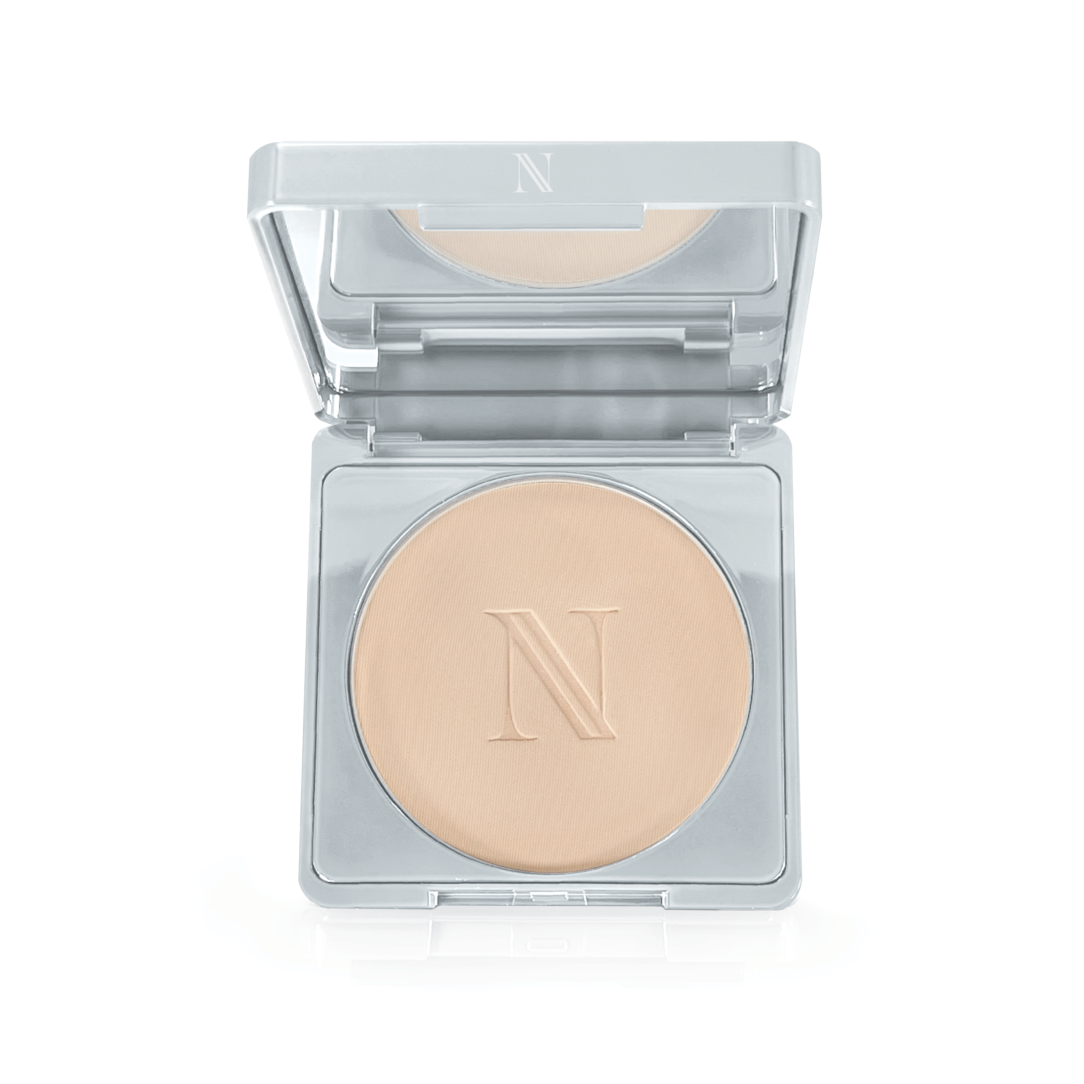 The Nikita Banana Brightening Powder by Shopgalaxys comes in a compact silver case with a mirror and features a beige pressed powder embossed with an N for flawless application.