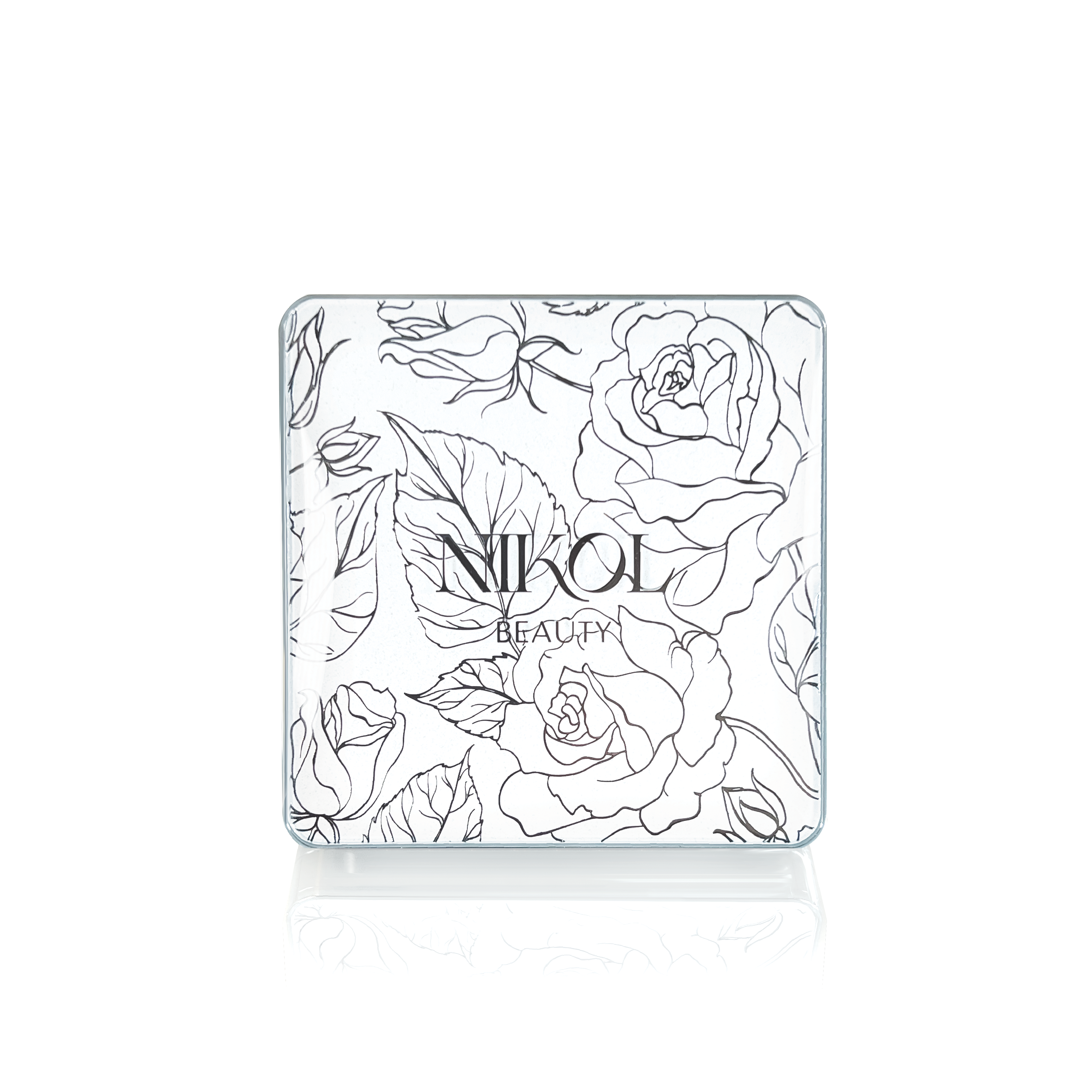 The Crème Brûlée compact by Shopgalaxys features an intricate black and white floral pattern with roses and leaves on the lid. Inside, it offers a cruelty-free bronzer ideal for adding a sun-kissed glow to mature skin.
