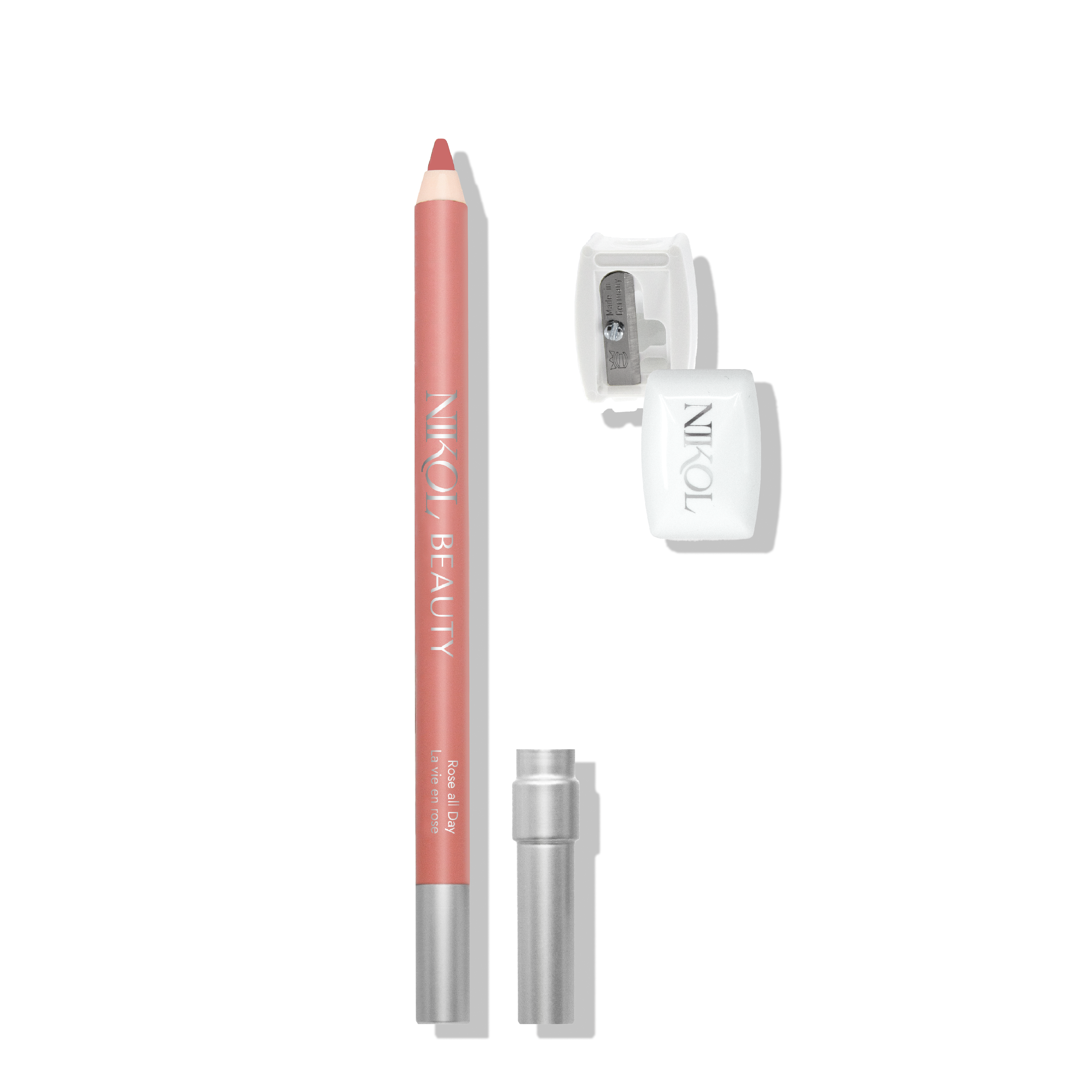 A pink lip pencil bearing Shopgalaxys is paired with a clear sharpener and silver cap, ready for professional use. Its pointed tip ensures precision, making it indispensable in any makeup bag on a plain white background.