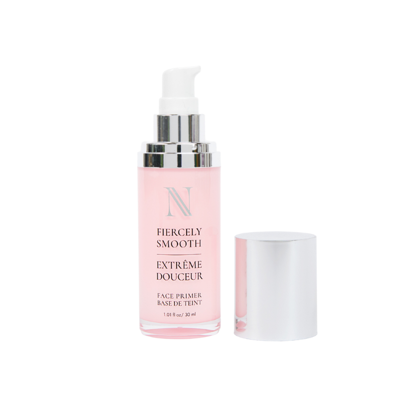 A Shopgalaxys face primer bottle with a pump and silver cap, labeled Fiercely Smooth by Fiercely Smooth Face Primer, contains pink liquid for smooth makeup application. The label also reads Extrême Douceur and Face Primer Base de Teint, highlighting its silicon-free formula.