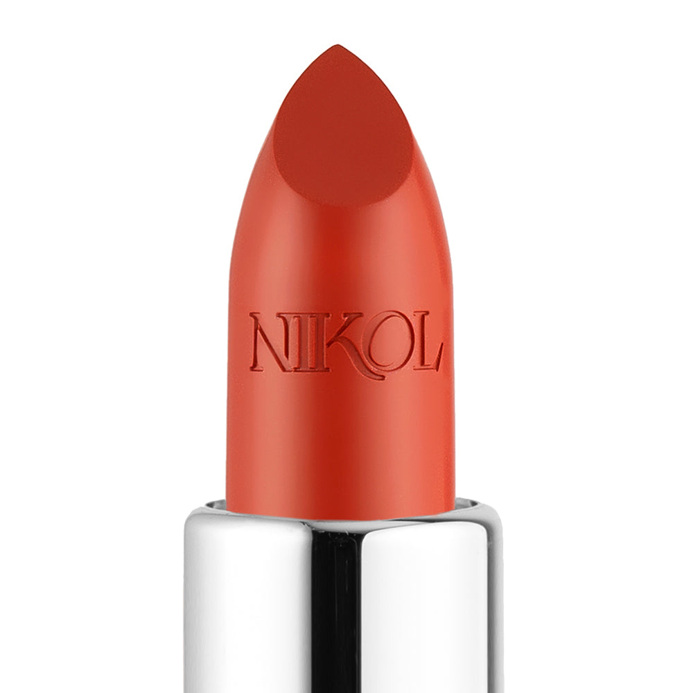 Close-up of Beach House Shiny Velvet Cream Lipstick #122 from Shopgalaxys, in a vibrant orange-red shade. This hydrating lipstick, enriched with shea butter for smooth application and nourishment, features a shiny silver base contrasting with the plain white background and has the brand name engraved on the bullet.