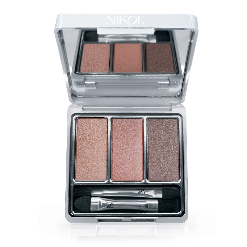 The Naughty Nancy 3-Well Eyeshadow Palette by Shopgalaxys features shimmery, long-wearing peach, pink, and bronze shades plus a dual-ended applicator in a silver compact labeled “NIKOL.”.