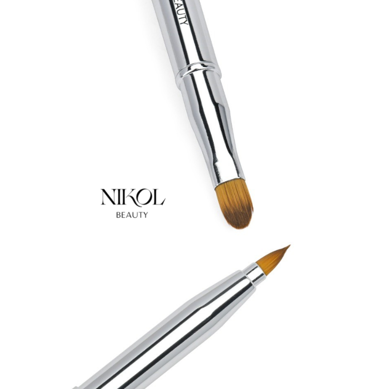 Two Shopgalaxys silver brushes are elegantly displayed on white: a rounded-tip precision concealer/lip brush and a pointed-tip brush, designed for your vegan-friendly makeup bag. The brand name is visible on the left side of the image.