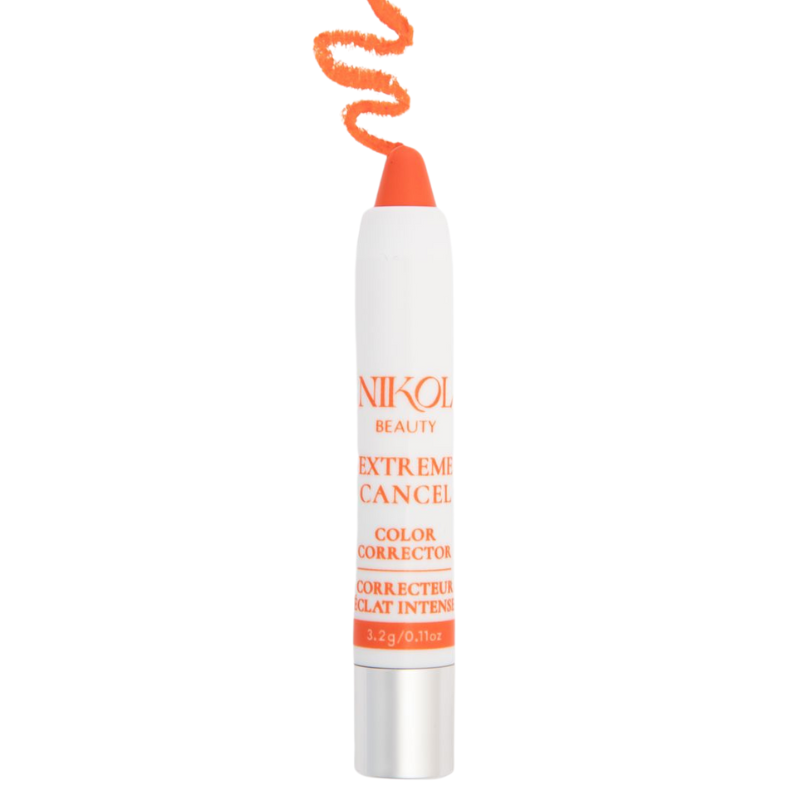 The Extreme Cancel Color Corrector by Shopgalaxys is a white cylindrical makeup stick with an orange tip, designed to neutralize dark under-eye areas and discoloration. The label text and a drawn line of makeup above the stick are both in orange.