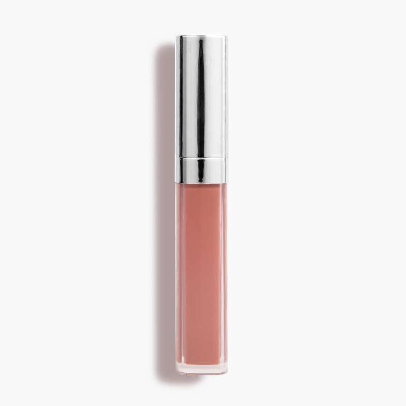 The Good Vibes Lip Gloss #443 by Shopgalaxys, in a nude shade with high-impact shine and a metallic silver cap, stands upright against a plain white backdrop.
