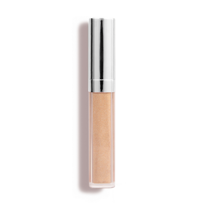 Nikol Beautys Manifest & Glow #183 is a sleek nude lip gloss with avocado oil for high shine, featuring a metallic silver cap. Set on a white background, its minimalist design is highlighted by shadows falling left, epitomizing clean beauty.